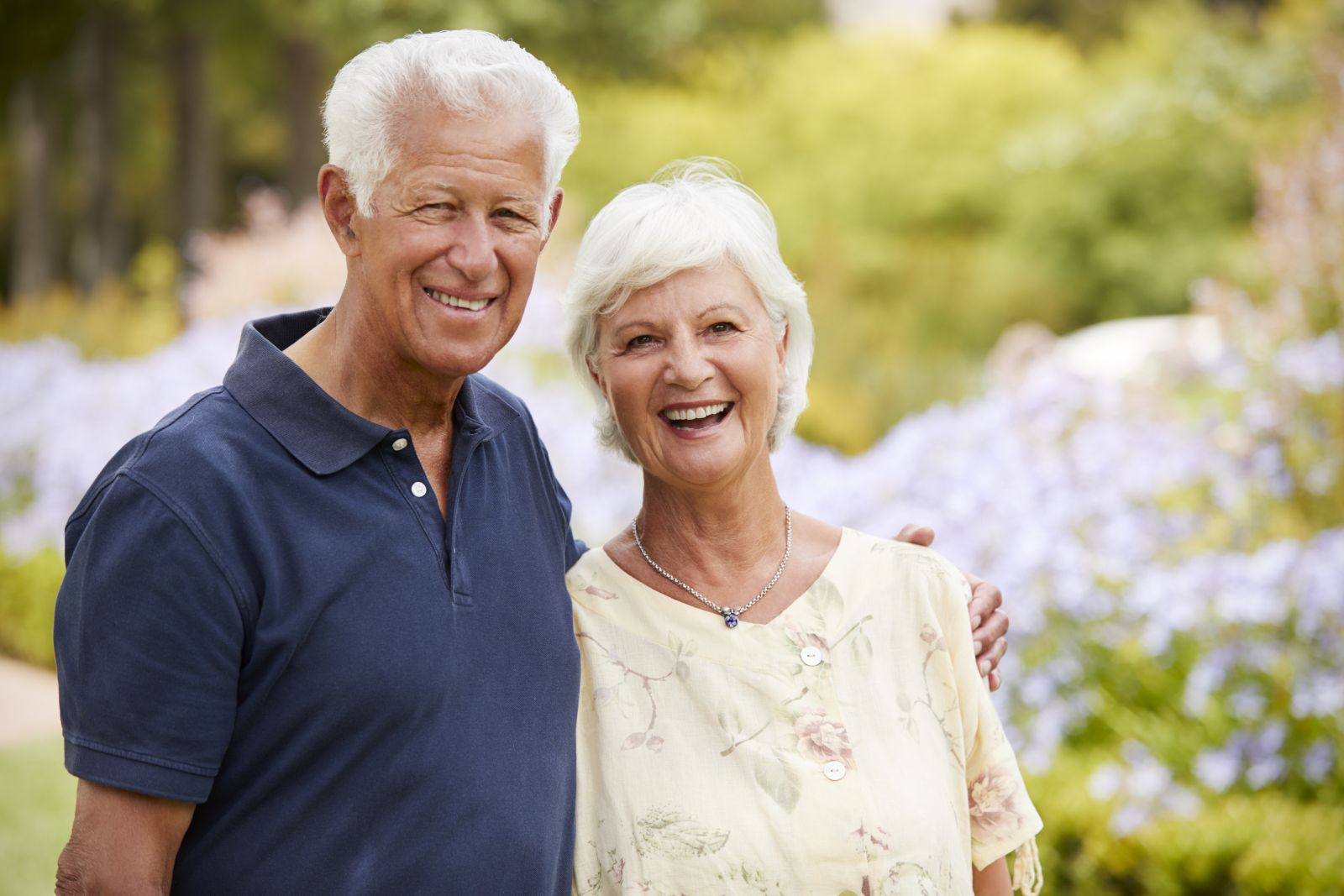 Smiling senior couple enjoying outdoor scenery